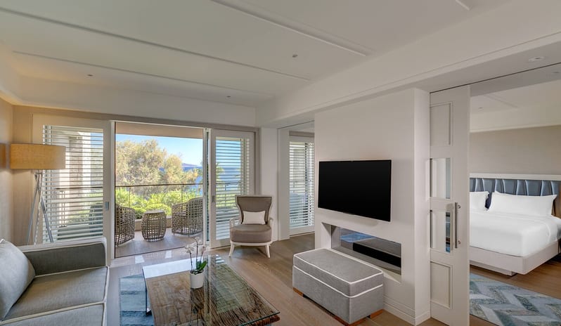 CARESSE HOTEL - ONE BEDROOM SUITE LIVING ROOM